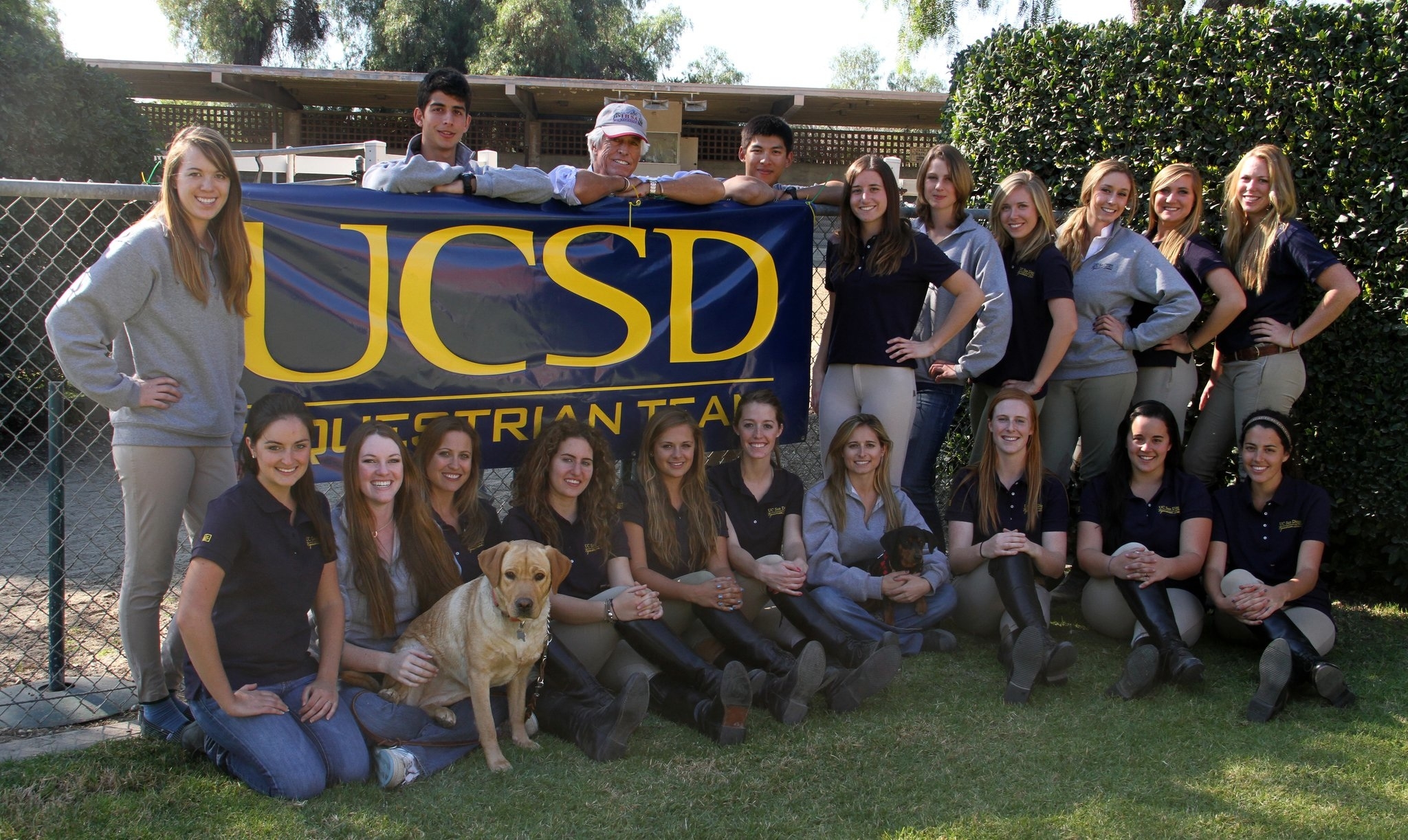 equestrian team picure with two cute puppy
