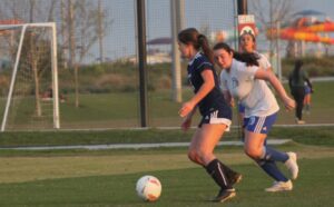 UCSD player kicking the ball