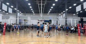 People playing volleyball at the gym