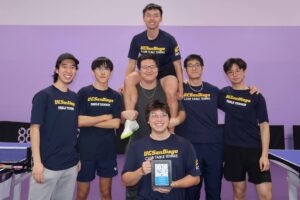 Team photo in uniform with their plague