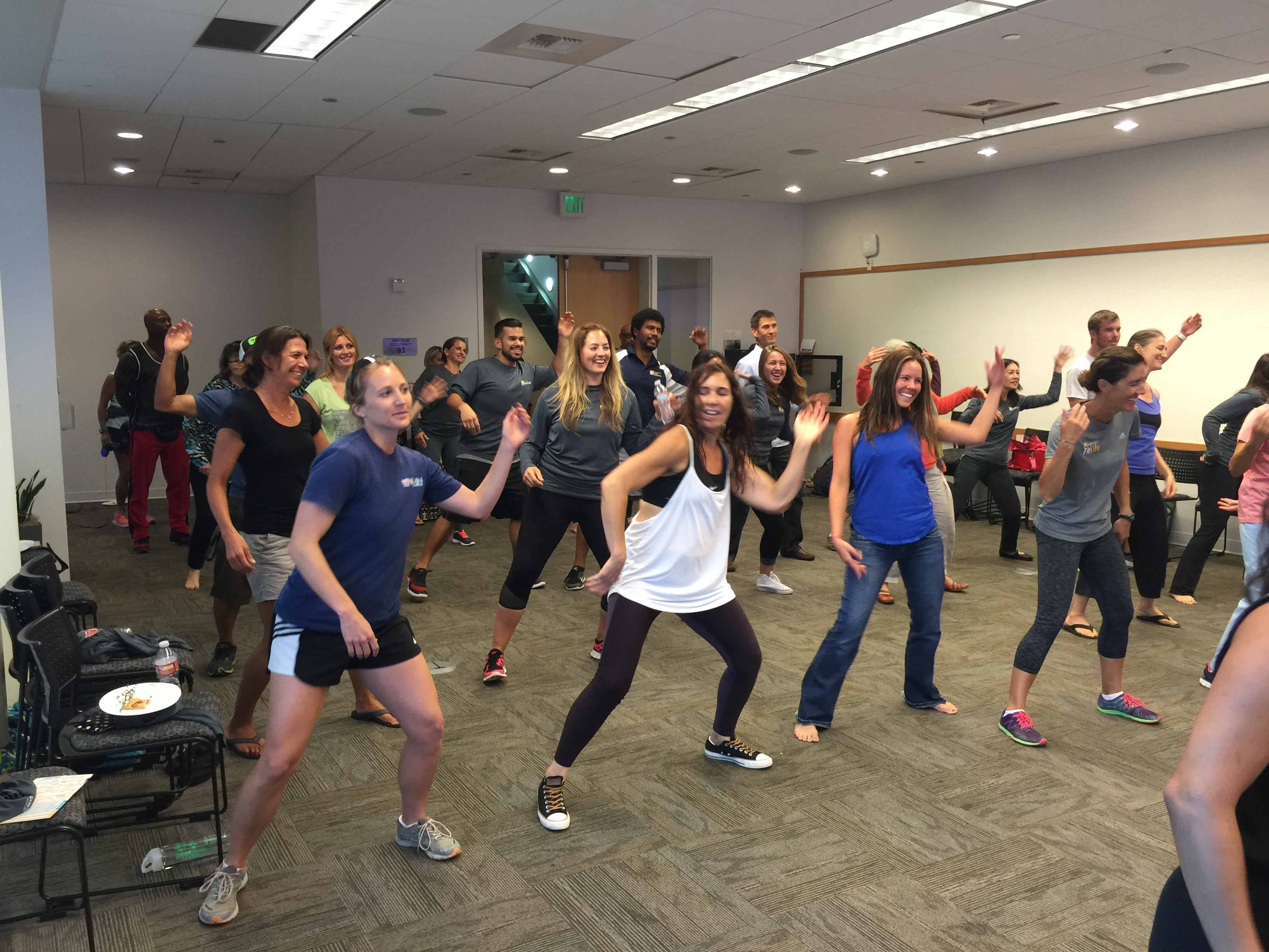 people dancing in a small room