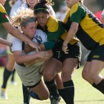 girls being tackled in rugby