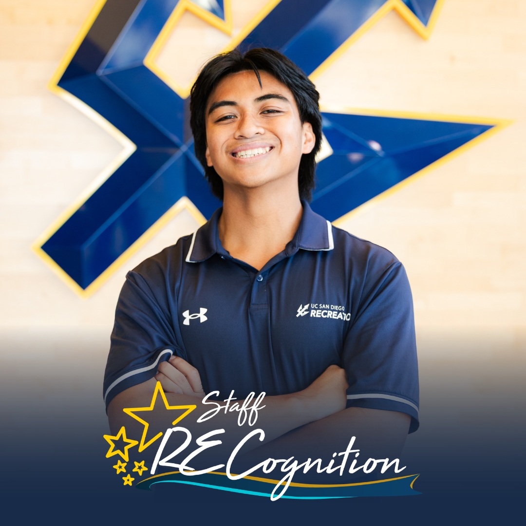 Angelo, a young man with dark hair wearing a blue polo, stands before a wooden wall with a blue UCSD Trident. A Staff RECognition logo is shown at the bottom.