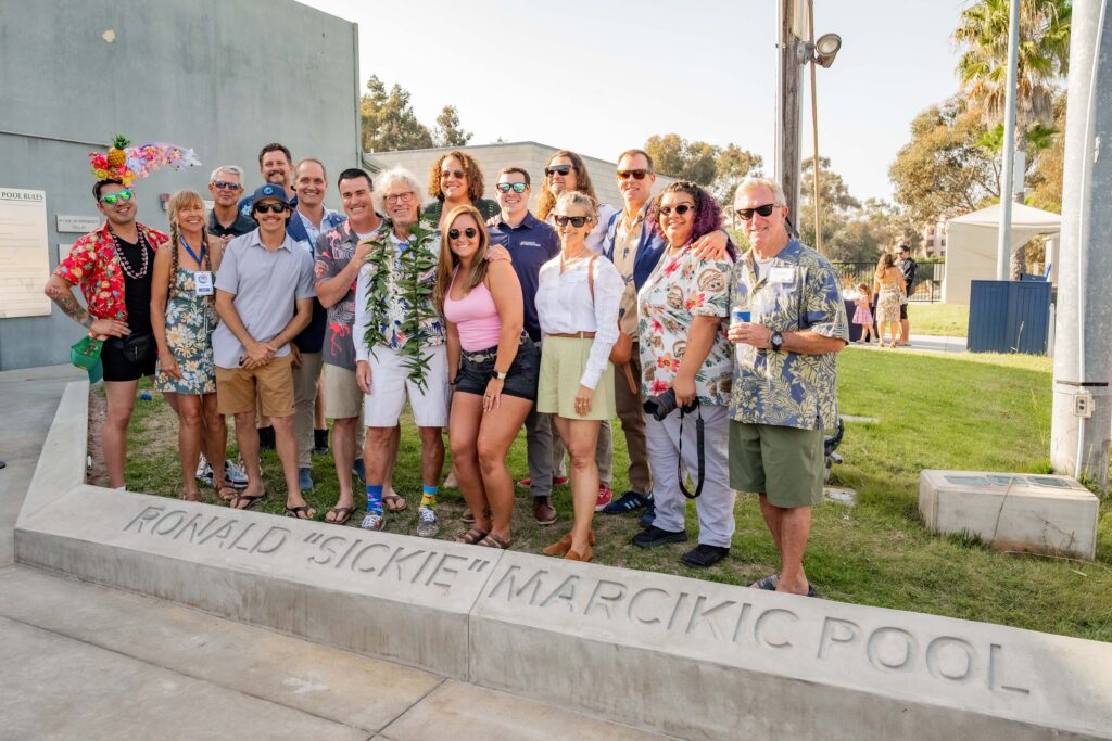Ronald “Sickie” Marcikic stands with fellow Recreation staff members during a pool naming ceremony in his honor on April 18, 2026.